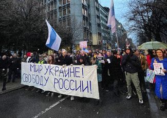 An antiwar demonstration in Belgrade in 2023. Banner reads, “Peace for Ukraine! Freedom for Russia!”