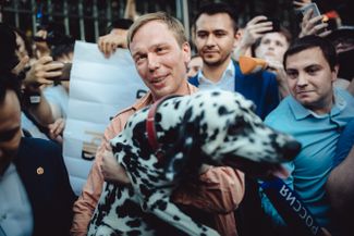 Ivan Golunov reunites with his dog following his release from house arrest on June 11, 2019.