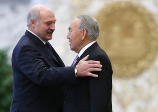 Nazarbayev with Belarusian President Alexander Lukashenko at a Commonwealth of Independent States summit in Minsk on October 10, 2014.