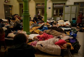 Ukrainian refugees resting in a shelter set up inside the Przemyśl railway station. March 3, 2022.