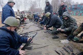 Self-defense volunteer forces undergo military training on a parade ground near Kiev. March 17, 2014