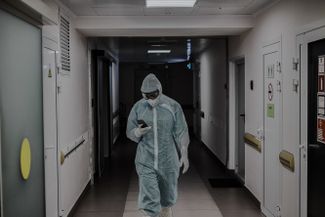 A doctor in the hallway of the hospital’s intensive care unit