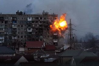 An explosion in a residential building during an air raid on Mariupol.