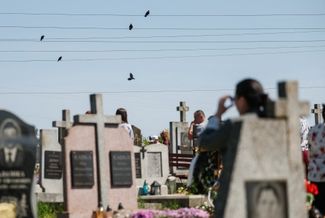 A cemetery in the town of Pustomyty in the Lviv region on Easter Sunday 