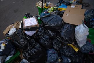 Dedications to Paris Mayor Anne Hidalgo appeared on garbage bags scattered around the city