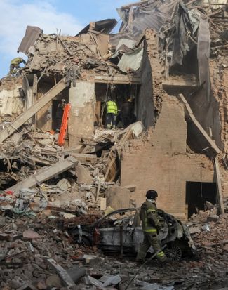 Rescuers remove debris in the Dnieper River, April 25, 2026
