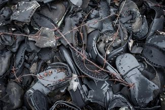 A pile of worn-out shoes that belonged to inmates