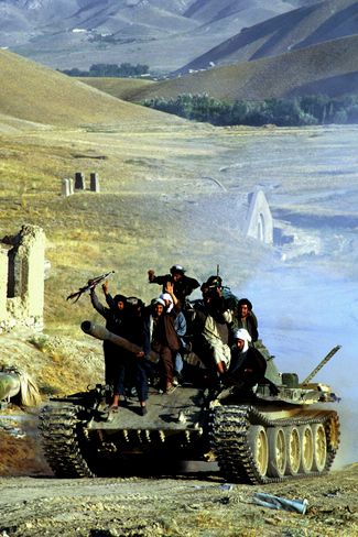 Taliban soldiers on a tank. 1996.