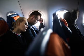 Navalny and his wife during a flight to Yekaterinburg, where his presidential campaign is opening a local headquarters. February 24, 2017.