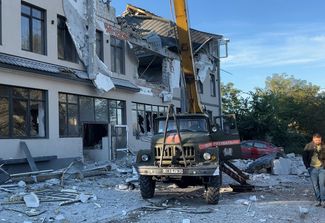 Гостиница в Херсоне, частично разрушенная в результате ракетного удара, 25 сентября 2022 года