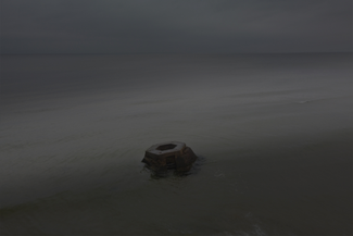 The base of a searchlight that was installed at a Soviet military base near Jūrkalne. Due to coastal erosion, it’s long been submerged in the sea. October 2024. 