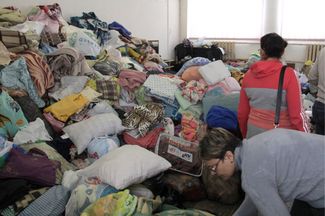 Blankets, pillows, and other items donated to the apartment blast victims. January 1, 2019