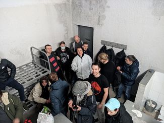 The holding cell where Sergey Smirnov (in the coroner by the door) and other detainees were placed on the morning of February 4