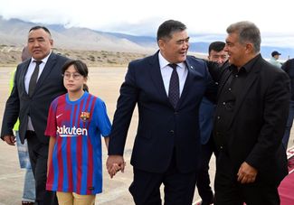 Kyrgyzstan’s spy chief Kamchybek Tashiev (center) and FC Barcelona club president Joan Laporta (right). Kyrgyzstan, August 2023. 