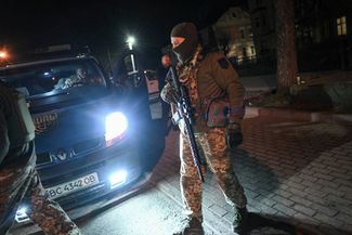 Terrodefense fighters in Lviv patrol the streets during the curfew
