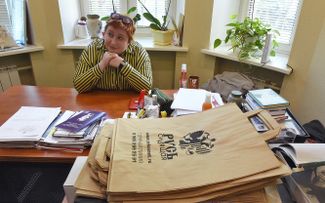 Olga Romanova sits in the Rus’ Imprisoned office while law enforcement officials conduct a search. June 8, 2017