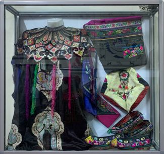 Traditional Dungan clothing at the Dungan Cultural Museum in Masanchi, Kazakhstan. December 2022