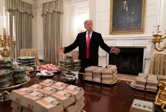 President Donald Trump presents fast food at the White House to be served to the Clemson Tigers football team to celebrate their national championship. January 14, 2019.