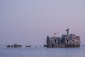 A lighthouse on one of the breakwaters in the port of Liepāja. June 2024.