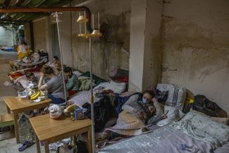 Mothers and children take shelter in the basement of the Okhmatdet children’s hospital in Kyiv