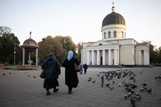 Two women walk towards the Moldovan Orthodox Cathedral of Christ’s Nativity in Chișinău. October 22, 2023.