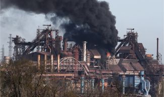 Smoke rises above a plant at the Azovstal Iron and Steel Works complex during Russia’s siege of Mariupol. April 25, 2022.
