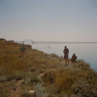 July 28th and 29th 2022. Kerch peninsula, Russian-occupied Crimea. Evgeniy, Stanislav and their fellow fishermen fish from a camp sitting at the southern tip of the Kerch peninsula in Russian-occupied Crimea right next to the Crimean bridge. The 18km-bridge, partly destroyed on October 8th 2022 by a truck bomb, links Crimea to the Russian mainland and is a symbol of Putin’s determination to anchor Crimea into the Russian Federation since its annexation in 2014. The bridge is also considered an environmental disaster for destroying the ecological balance in the Sea of Azov, disrupting the flow of water between the Black and Azov Sea and impeding fish migration. The fishermen mentioned the fish population had dropped massively since the building of the bridge.