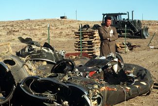 A Soviet inspector examines a dismantled Pershing-II missile in the United States in 1989