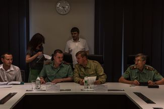A meeting of the committee for market nationalization, comprised of the DPR People's Council deputies. Third from the left is the committee chairman, Colonel Sergei Zavdoveyev.