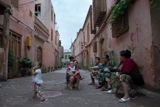 Uyghur women gather in the Old City in Kashgar before a Chinese language lesson