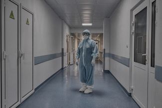 A doctor in the hallway of the intensive care unit
