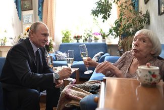 President Vladimir Putin congratulates Lyudmila Alexeyeva on her 90th birthday at her apartment in Moscow on April 20, 2017