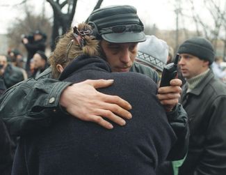 Friends and relatives of the hostages wait for their release in a square near the Dubrovka Theater. By the morning of October 25, the terrorists release another seven people.